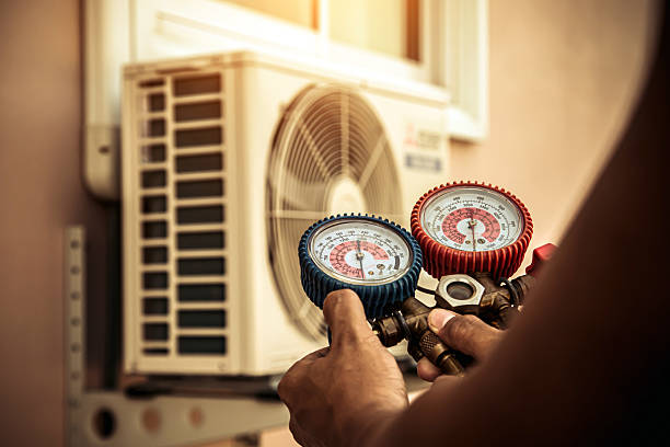Professional Hvac technician working in Marshfield Hills, MA